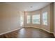 Bright living room featuring hardwood floors and a large front door with sidelights at 433 Orchid Ln, Canton, GA 30114