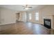 Bright living room with wood flooring and a fireplace at 433 Orchid Ln, Canton, GA 30114