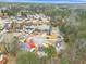 Aerial view of neighborhood showcasing a serene pond amidst lush greenery and well-kept homes at 1029 Chaterly Ct, Riverdale, GA 30296