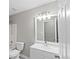 Bathroom featuring a vanity with mirror and lighting, toilet, and tiled walk-in shower at 1029 Chaterly Ct, Riverdale, GA 30296