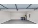 Clean garage with painted floor, laundry hookups, water heater, and door to interior at 1029 Chaterly Ct, Riverdale, GA 30296