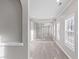 Bright hallway with fresh paint, hardwood floors, and white trim at 1029 Chaterly Ct, Riverdale, GA 30296