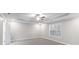 Spacious main bedroom featuring a ceiling fan and a window at 1029 Chaterly Ct, Riverdale, GA 30296