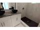 Bathroom featuring double vessel sinks, granite countertop, tiled walls and walk-in shower at 1092 Hillcrest Se Dr, Atlanta, GA 30316