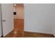 Bedroom view showing wooden floors, white walls and trim, and open doorway at 1092 Hillcrest Se Dr, Atlanta, GA 30316