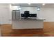 Kitchen features granite countertops, stainless steel appliances, island, and white cabinets at 1092 Hillcrest Se Dr, Atlanta, GA 30316