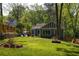 Charming home exterior featuring a greenhouse and a well-maintained lawn at 1608 Terry Mill Se Rd, Atlanta, GA 30316