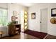 Welcoming foyer featuring hardwood floors and eye-catching yellow door that leads to the outside at 1608 Terry Mill Se Rd, Atlanta, GA 30316