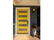 Stylish yellow front door with glass panels, complemented by a potted plant and outdoor lighting at 1608 Terry Mill Se Rd, Atlanta, GA 30316