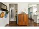 Open hallway leading to the kitchen and bathroom, showcasing hardwood floors and stylish decor at 1608 Terry Mill Se Rd, Atlanta, GA 30316