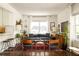 Bright living room with a comfortable gray sofa, area rug, and plenty of natural light at 1608 Terry Mill Se Rd, Atlanta, GA 30316