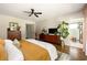 Spacious main bedroom features hardwood floors, neutral walls, and a view into the bathroom at 1608 Terry Mill Se Rd, Atlanta, GA 30316