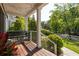 Inviting porch with hanging bench, string lights, and view of the well-maintained yard at 1608 Terry Mill Se Rd, Atlanta, GA 30316