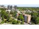 High-angle aerial view featuring the property, surrounding trees, cityscape, and nearby buildings at 2965 Pharr Court South Nw # 110, Atlanta, GA 30305