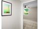 Bedroom entryway featuring artwork leading to the room with ceiling fan and a window at 2965 Pharr Court South Nw # 110, Atlanta, GA 30305