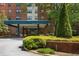 Building entrance with a covered entryway and well-maintained landscaping leading to the front doors at 2965 Pharr Court South Nw # 110, Atlanta, GA 30305