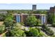 Aerial view showcasing the building's exterior, surrounded by lush greenery and views of the cityscape at 2965 Pharr Court South Nw # 110, Atlanta, GA 30305
