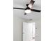 Bedroom with ceiling fan, white walls, and door leading to the hallway at 2965 Pharr Court South Nw # 110, Atlanta, GA 30305