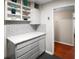 Stylish kitchen featuring white countertops, subway tile backsplash, and ample cabinet space at 2965 Pharr Court South Nw # 110, Atlanta, GA 30305