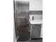 Kitchen with new, stainless steel Bosch refrigerator and dishwasher with white backsplash at 2965 Pharr Court South Nw # 110, Atlanta, GA 30305