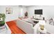 Living room with hardwood floors, modern furniture and decor, and large screen tv at 2965 Pharr Court South Nw # 110, Atlanta, GA 30305