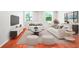 Bright living room with hardwood floors, lots of natural light, modern furniture and large screen tv at 2965 Pharr Court South Nw # 110, Atlanta, GA 30305