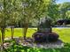 Elegant Slaton Manor condominium signage surrounded by manicured landscaping on a sunny day at 2965 Pharr Court South Nw # 110, Atlanta, GA 30305