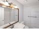 Updated bathroom featuring a new vanity, large mirror, and decorative wall paneling at 304 N Briar Rdg, Woodstock, GA 30189
