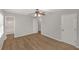 Spacious bedroom with wood floors, ceiling fan, and access to bathroom and closet at 304 N Briar Rdg, Woodstock, GA 30189