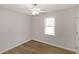 Bedroom with wood-look flooring, new trim, and a window providing natural light at 304 N Briar Rdg, Woodstock, GA 30189