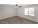 Bright bedroom features a ceiling fan, wood floors and double window at 304 N Briar Rdg, Woodstock, GA 30189