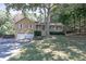 Charming home featuring a well-maintained front yard, covered porch, and attached two-car garage at 304 N Briar Rdg, Woodstock, GA 30189