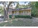 Inviting single-Gathering home showcasing a cozy covered porch and a beautifully landscaped front yard at 304 N Briar Rdg, Woodstock, GA 30189