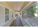 View from the covered front porch overlooking a serene yard at 304 N Briar Rdg, Woodstock, GA 30189