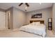 Spacious bedroom with a ceiling fan, large window, and king bed with white bedding at 873 Edgewater Cir, Marietta, GA 30062