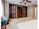Spacious bedroom with a ceiling fan, large closet and king bed with white bedding at 873 Edgewater Cir, Marietta, GA 30062