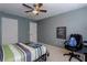 Bedroom with a ceiling fan, a large window and a striped comforter on the bed at 873 Edgewater Cir, Marietta, GA 30062