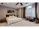 Spacious bedroom with a ceiling fan, large window, and king bed with white bedding at 873 Edgewater Cir, Marietta, GA 30062