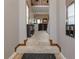 The entryway showcases carpeted stairs, high ceilings, and unique display shelves at 873 Edgewater Cir, Marietta, GA 30062