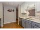 Updated kitchen with stainless appliances, grey cabinetry, and convenient breakfast bar at 873 Edgewater Cir, Marietta, GA 30062