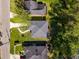 Aerial view showcases the home's roof, surrounding landscaping, and neighborhood streets at 2358 Larchwood Sw Rd, Atlanta, GA 30310