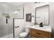 Beautifully renovated bathroom featuring modern fixtures, a glass shower, and stylish vanity at 2358 Larchwood Sw Rd, Atlanta, GA 30310