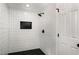 Tiled shower features matte black fixtures and a stylish niche at 2358 Larchwood Sw Rd, Atlanta, GA 30310