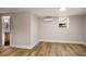 Bedroom featuring hardwood floors, neutral walls, and a window at 2358 Larchwood Sw Rd, Atlanta, GA 30310