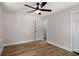 Bedroom featuring hardwood floors, neutral walls, and a ceiling fan at 2358 Larchwood Sw Rd, Atlanta, GA 30310