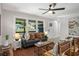 Comfortable living room featuring a stylish sofa, accent chairs, and plenty of natural light at 2358 Larchwood Sw Rd, Atlanta, GA 30310