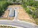 New townhomes on large lot feature sidewalks and convenient parking at 2405 Malster Ln, Lawrenceville, GA 30043
