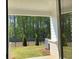 Private backyard with a well-maintained lawn and mature trees at 2405 Malster Ln, Lawrenceville, GA 30043