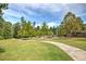 Scenic community park featuring a playground, walking path, and lush green space at 2405 Malster Ln, Lawrenceville, GA 30043