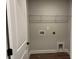 A simple laundry room features hard floors and shelving at 2405 Malster Ln, Lawrenceville, GA 30043